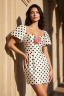 Polka Dot Off The Shoulder Mini Dress With Flower in White - SHE IS ME